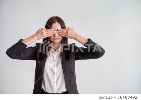 woman in a suit, blocking her eyes, business 36407492