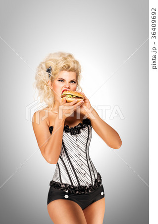 Eating burger. 36409692