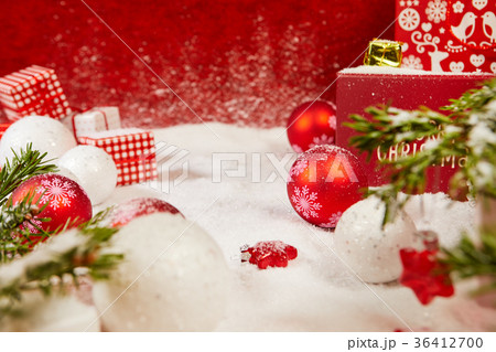 Christmas background with baubles in snow Christmas background with baubles in snow 36412700