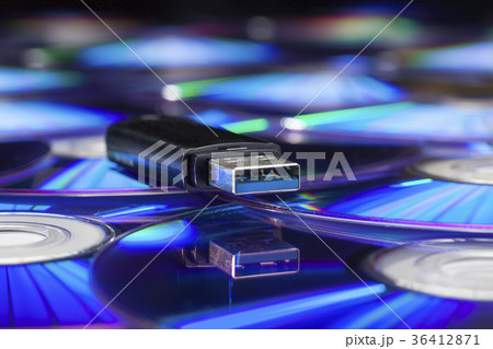 Usb stick on a pile of cds Usb stick on a pile of cds 36412871