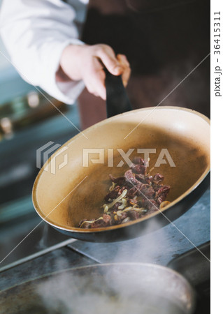 The process of frying meat in a pan The process of frying meat in a pan 36415311