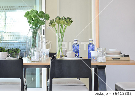 elegant table set in modern style dining room 36415882