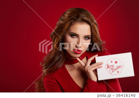 Woman with christmas box gift 36416140