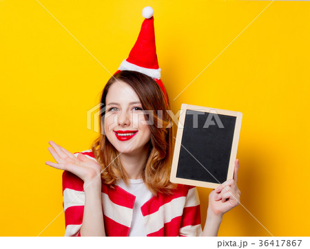 woman in Santa Claus hat with blackboard 36417867