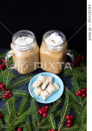 Candies and cocoa with marshmallows on a black Candies and cocoa with marshmallows on a black 36418284