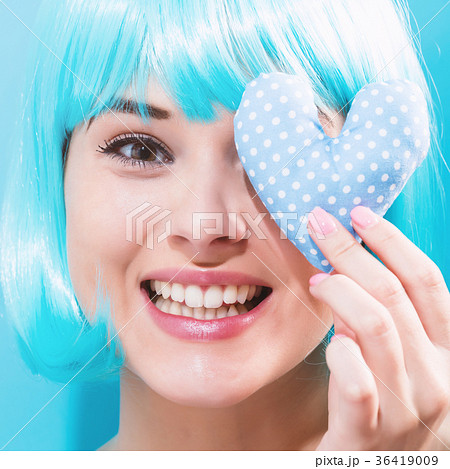 Beautiful woman in a bright blue wig 36419009