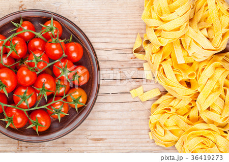 uncooked pasta and fresh tomatoes uncooked pasta and fresh tomatoes 36419273