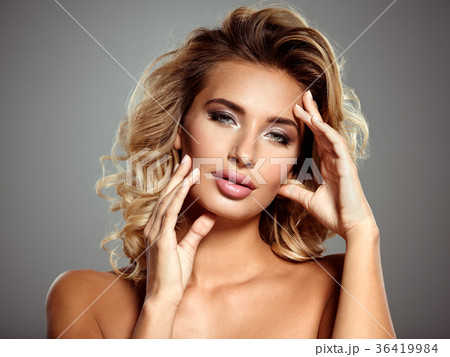 Photo of a beautiful  blond woman with flower 36419984