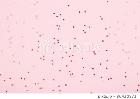 Pink background with red star glitter. 36420573