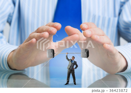 Businessman covered with palms 36423872