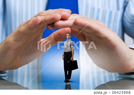 Businesswoman covered with palms 36423908