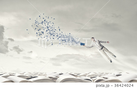 Man with book in hand 36424024