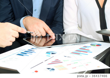 business colleagues working together and analyzing 36437466