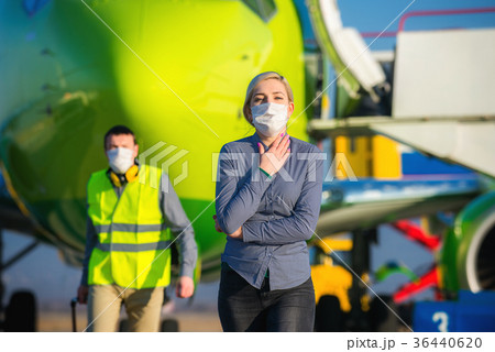 Sick passenger at an airport Sick passenger at an airport 36440620