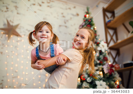 Photo of two sisters in background of New Year's 36443083