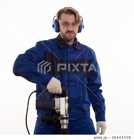 Construction worker stands leaning on the puncher 36443559