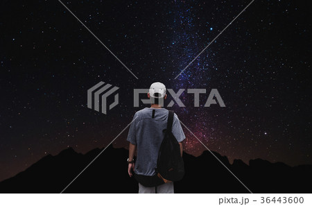 a man with backpack looking stars at night a man with backpack looking stars at night 36443600