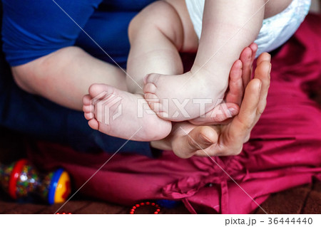 Baby feet and mother hands 36444440