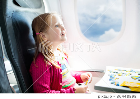 Child in airplane. Fly with family. Kids travel. Child in airplane. Fly with family. Kids travel. 36448898