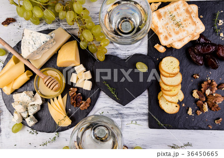 Cheese plate. Assortment of cheese with walnuts 36450665