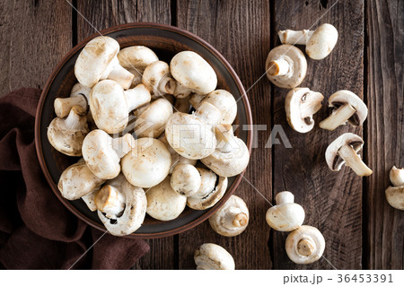Fresh mushrooms on wooden table, top view 36453391