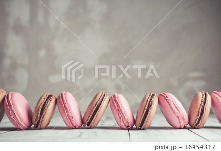 Raspberry and Chocolate pastel colored Macarons 36454317