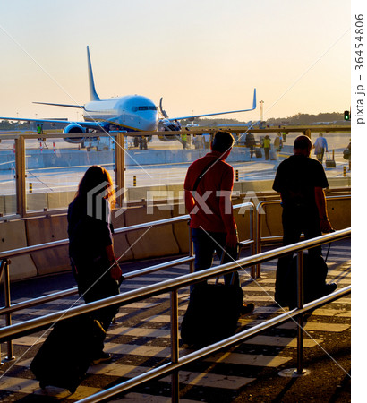 Boarding plane at airport Boarding plane at airport 36454806