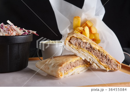 Beef cutlet with cheese rolled in pita Beef cutlet with cheese rolled in pita 36455084