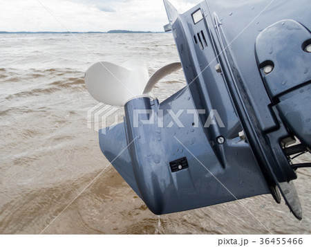 Outboard motor lifted up from water Outboard motor lifted up from water 36455466
