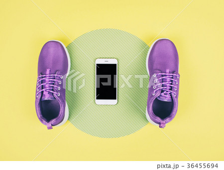 Flat lay shot of sneakers and smartphone. 36455694