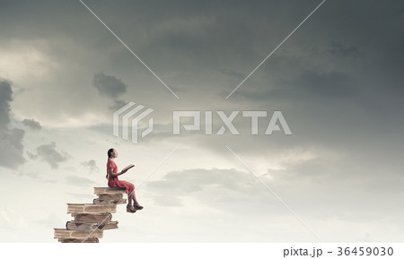 Woman in dress with book 36459030