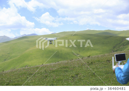 young woman flying drone outdoors young woman flying drone outdoors 36460481