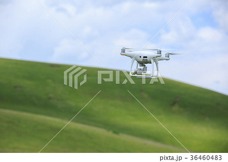 drone with the camera flying in the sky 36460483