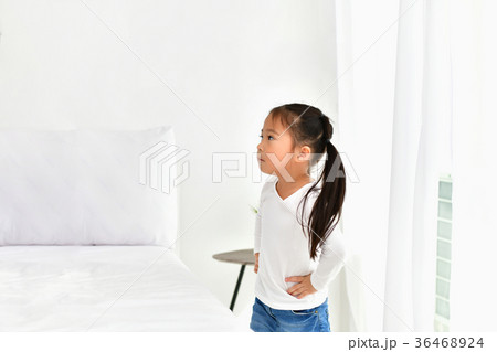 The girls are irritated in the white bedroom. 36468924