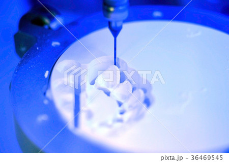 Dental milling machine carving out shape of human Dental milling machine carving out shape of human 36469545