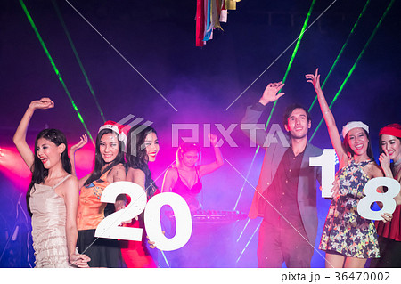 Teenagers are celebrating at the night party. Teenagers are celebrating at the night party. 36470002