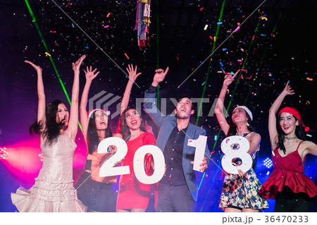 Teenagers are celebrating at the night party. Teenagers are celebrating at the night party. 36470233