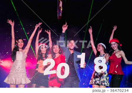 Teenagers are celebrating at the night party. Teenagers are celebrating at the night party. 36470234