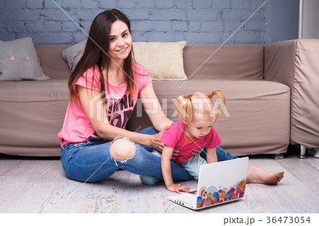 caucasian mother with daughter using computer caucasian mother with daughter using computer 36473054