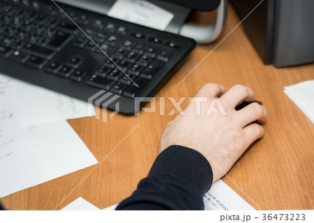 Top view of male hands working on computer Top view of male hands working on computer 36473223