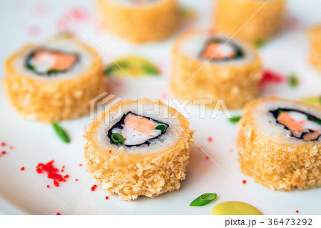 Sushi rolls scattered on white background 36473292