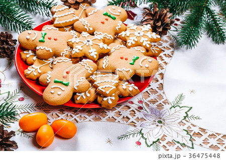 Christmas gingerbread cookies homemade on red Christmas gingerbread cookies homemade on red 36475448