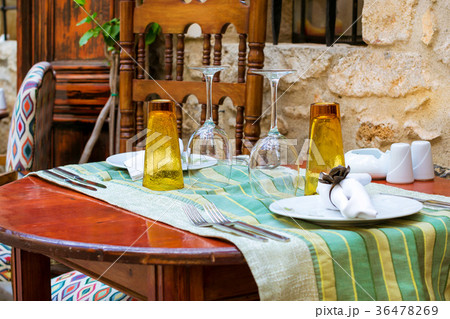 Served table in restaurant, Rethymno, Crete Greece Served table in restaurant, Rethymno, Crete Greece 36478269