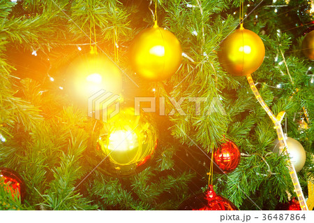 decorated christmas fir tree closeup with flares decorated christmas fir tree closeup with flares 36487864