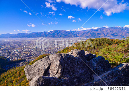 山梨県 紅葉の和田峠から甲府盆地を望むの写真素材