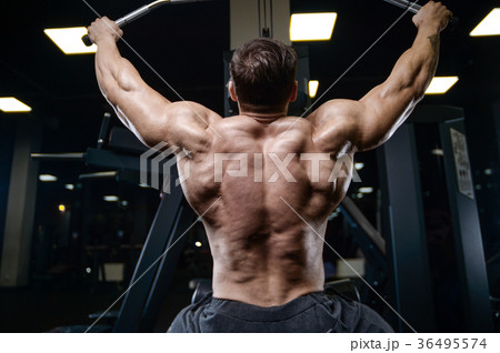 Brutal strong bodybuilder athletic men pumping up muscles with d Brutal strong bodybuilder athletic men pumping up muscles with d 36495574