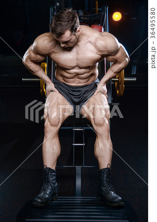 Brutal strong bodybuilder athletic men pumping up muscles with d Brutal strong bodybuilder athletic men pumping up muscles with d 36495580