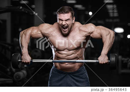 Brutal strong bodybuilder athletic men pumping up muscles with d Brutal strong bodybuilder athletic men pumping up muscles with d 36495643