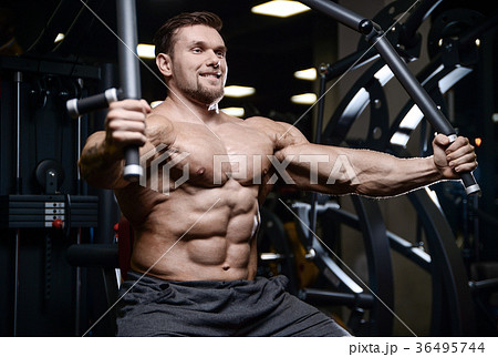 Brutal strong bodybuilder athletic men pumping up muscles with d Brutal strong bodybuilder athletic men pumping up muscles with d 36495744