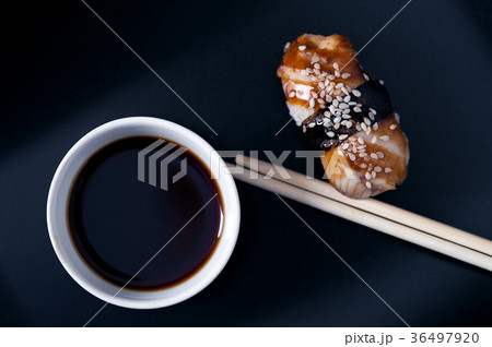 Eel sashimi, soy sauce and chopsticks, top view Eel sashimi, soy sauce and chopsticks, top view 36497920